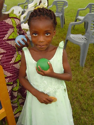 Child with water balloon
